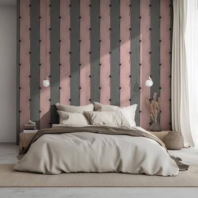 Modern bedroom with a large bed against a decorative wall with vertical stripes.