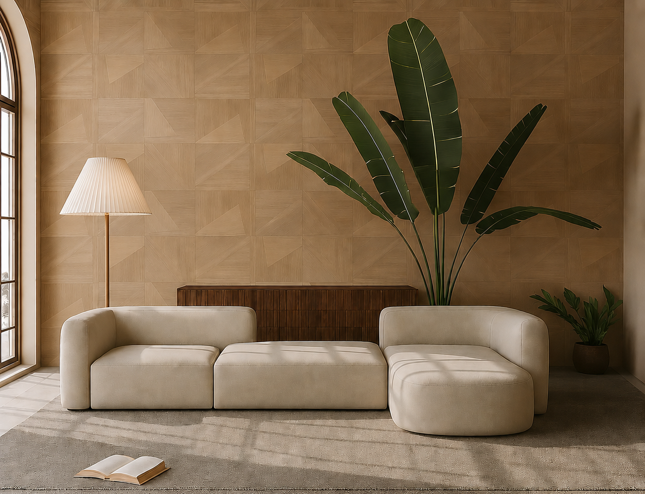 Beige sectional sofa in a room with a lamp, table, and plants.