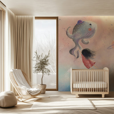 Nursery room with a crib, chair, and decorative wall mural.
