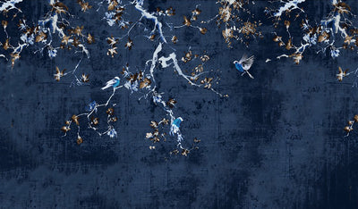 Aerial view of birds flying over a dark blue landscape with scattered lights.