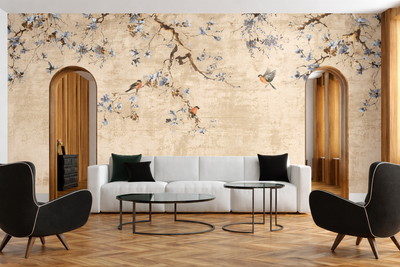 Living room with floral wall mural, white sofa, and black chairs.