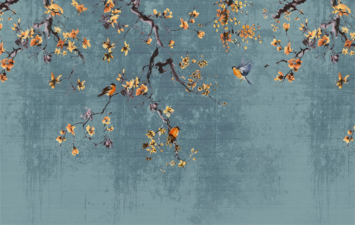 A decorative wall mural or wallpaper featuring a textured slate-blue background with watercolor-style branches, yellow-orange blossoms, and small birds.