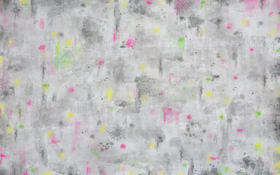 Textured gray surface with colorful abstract patterns