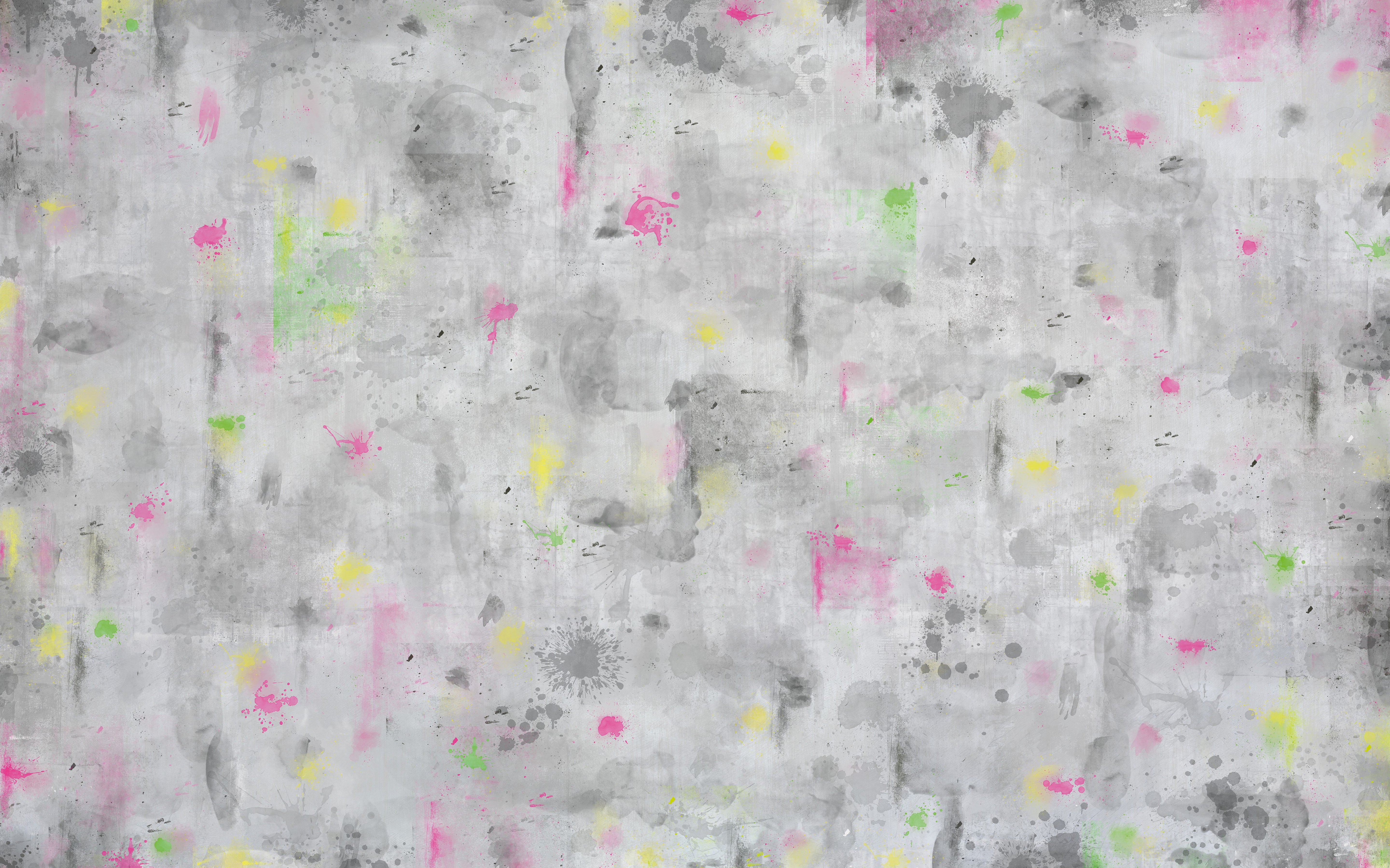 Textured gray surface with colorful abstract patterns