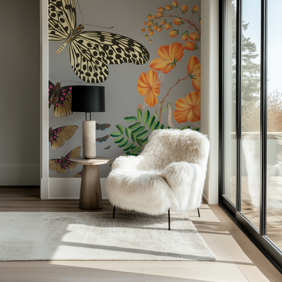 Modern living room with a white fur chair, decorative wall art, and large windows.