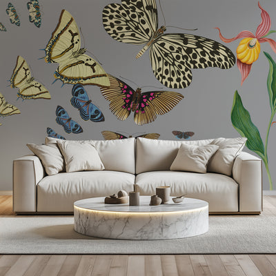 Beige sofa with decorative butterflies and flowers on a gray wall