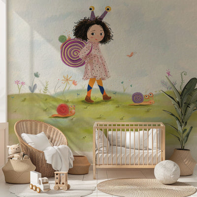 Children's room with a mural of a girl and snails, wicker chair, crib, and toys.