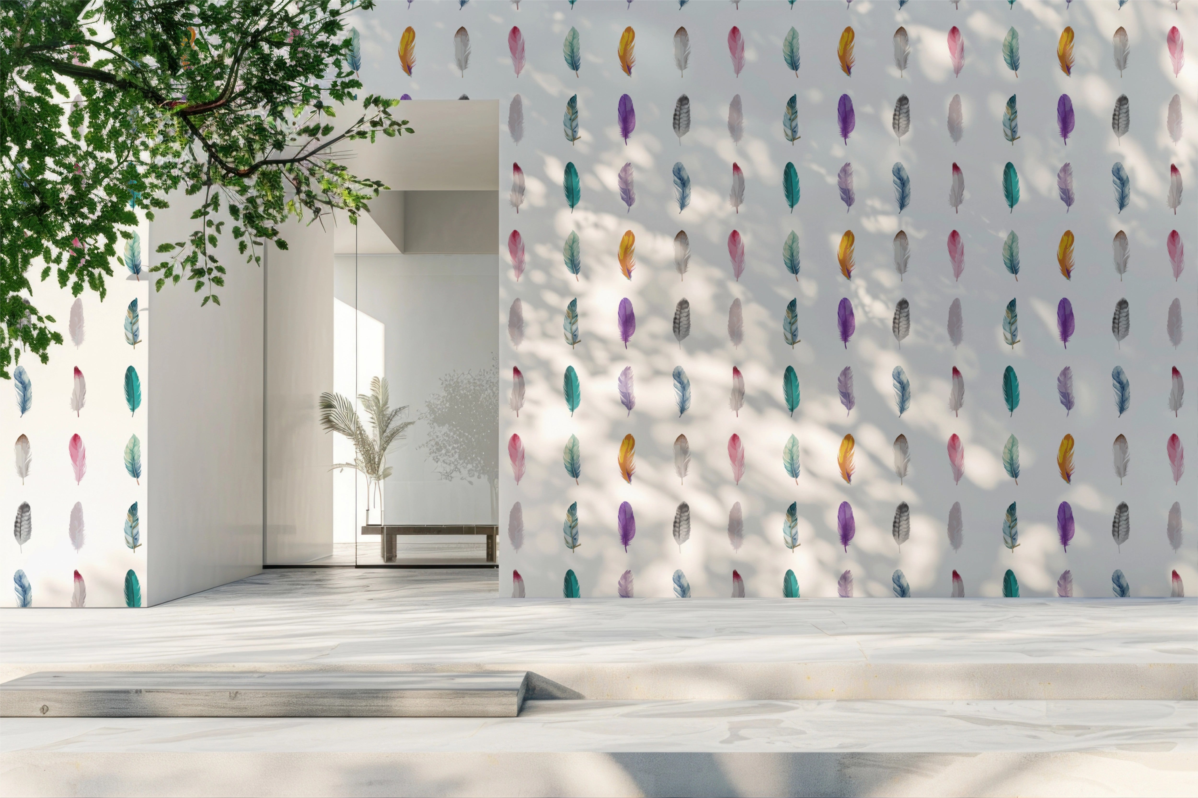 A modern white architectural wall covered in a repeating pattern of colorful feather illustrations, with a matching feather design on a side wall and a light stone floor in the foreground.